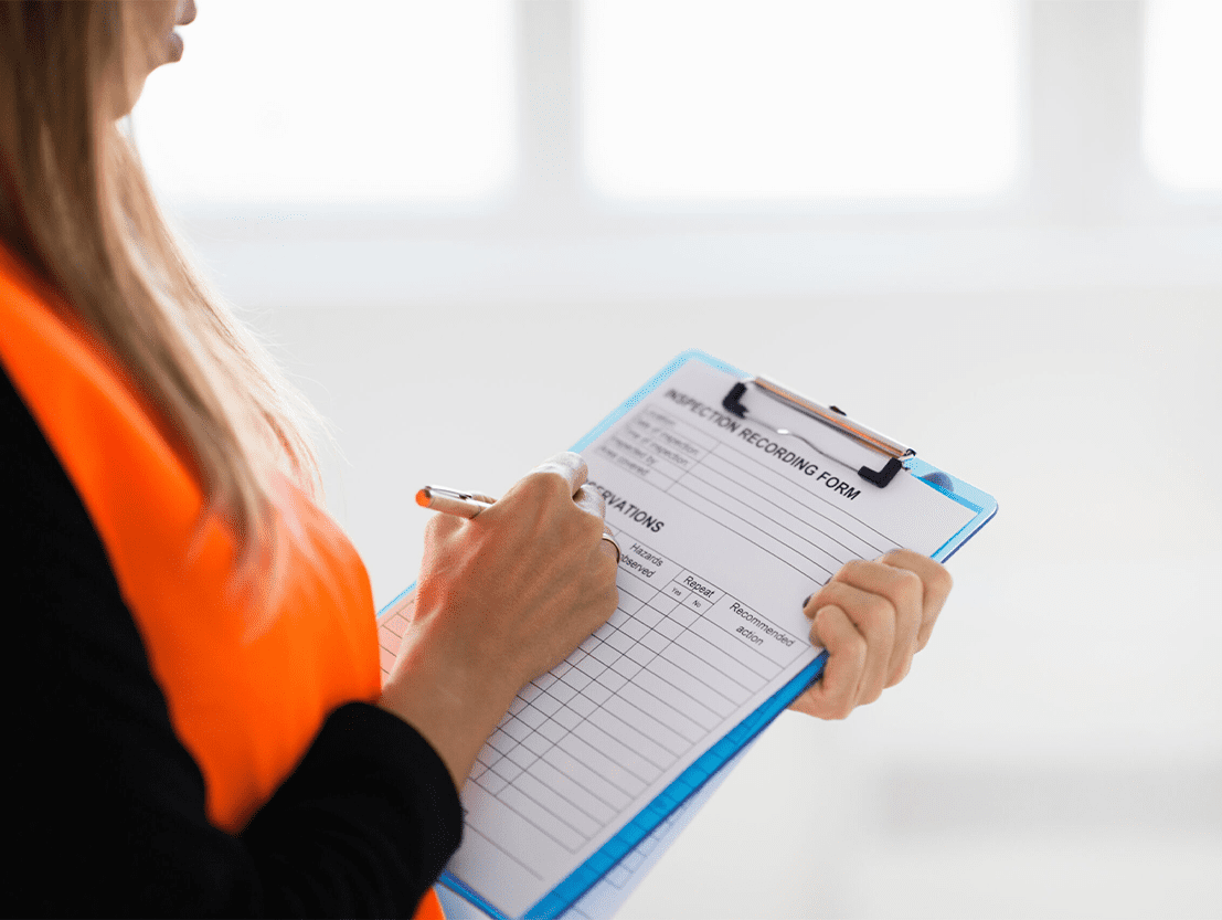 girl with annual maintenance checklist for fire appliances