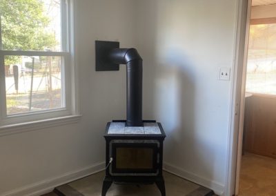 new stove in corner of a living room