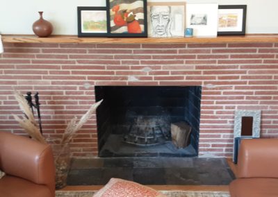 fireplace doors with brick surround before