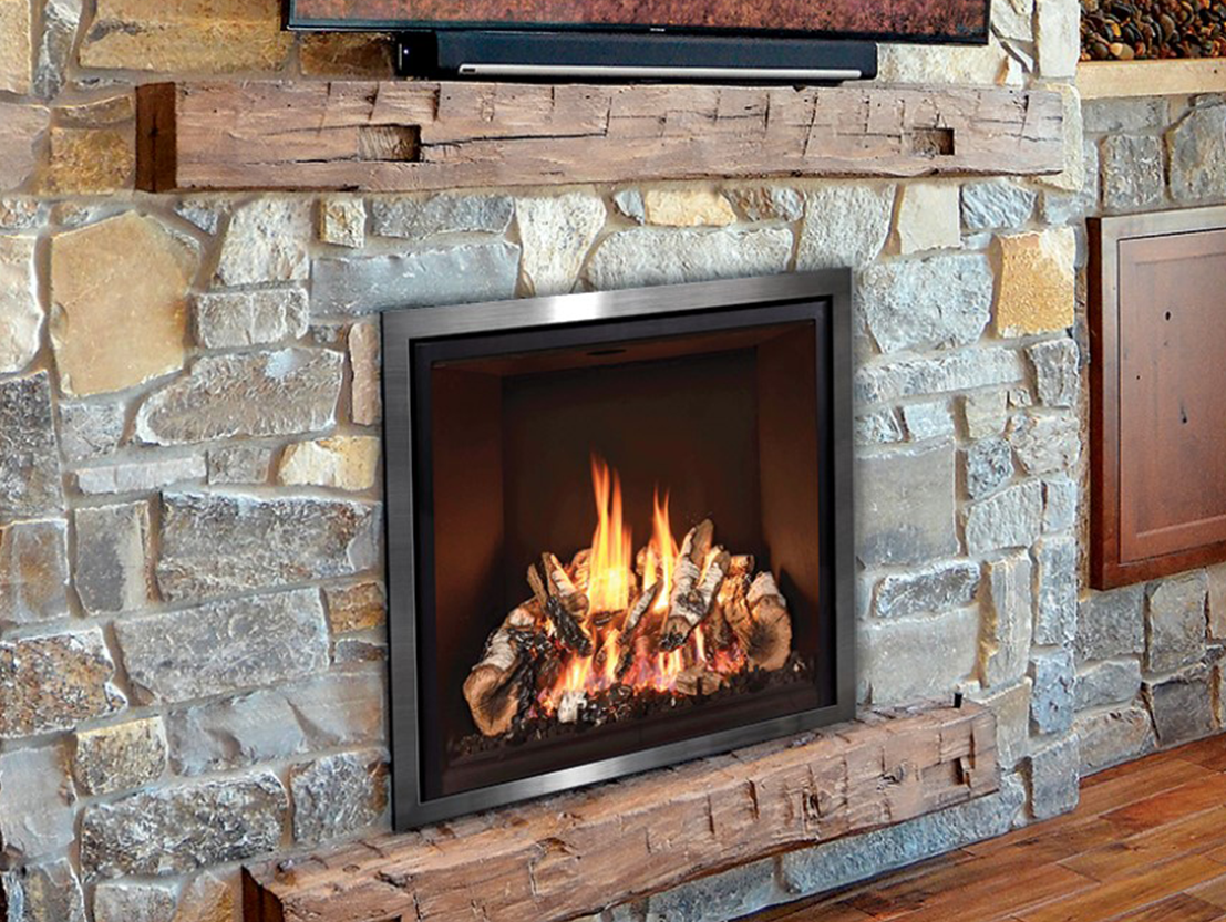 large multi-colored stone surround with drift wood mantel in indoor living room